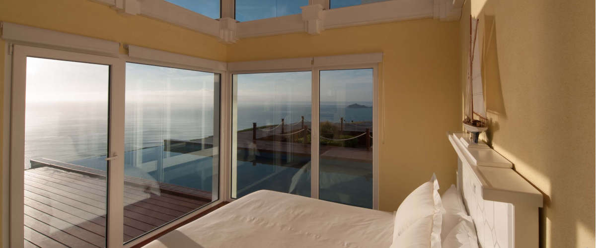 Experience unparalleled comfort in a luxury bedroom with breathtaking views